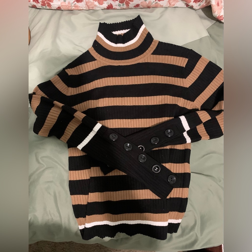 This is a s/p, Like new, Modern, Black & Tan turtleneck with buttons on the arms